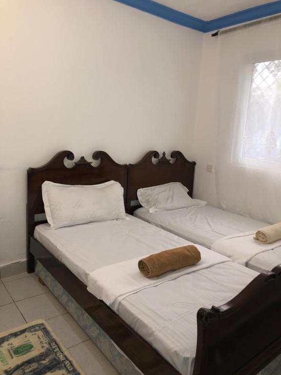 Кровать или кровати в номере Charming cottage near the beach