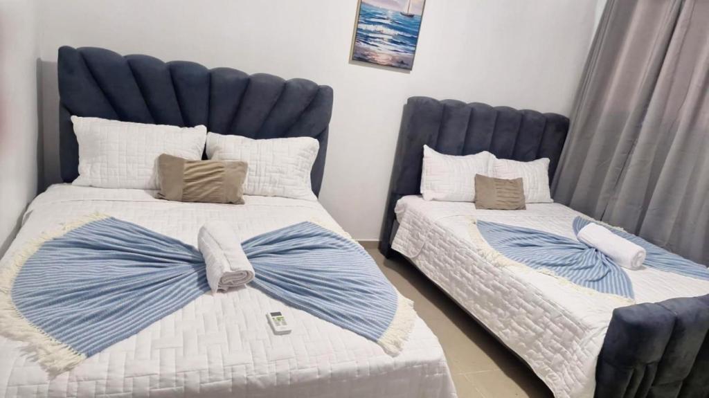 Postel nebo postele na pokoji v ubytování Modern 2BR Condo Near the Beach Juan Dolio