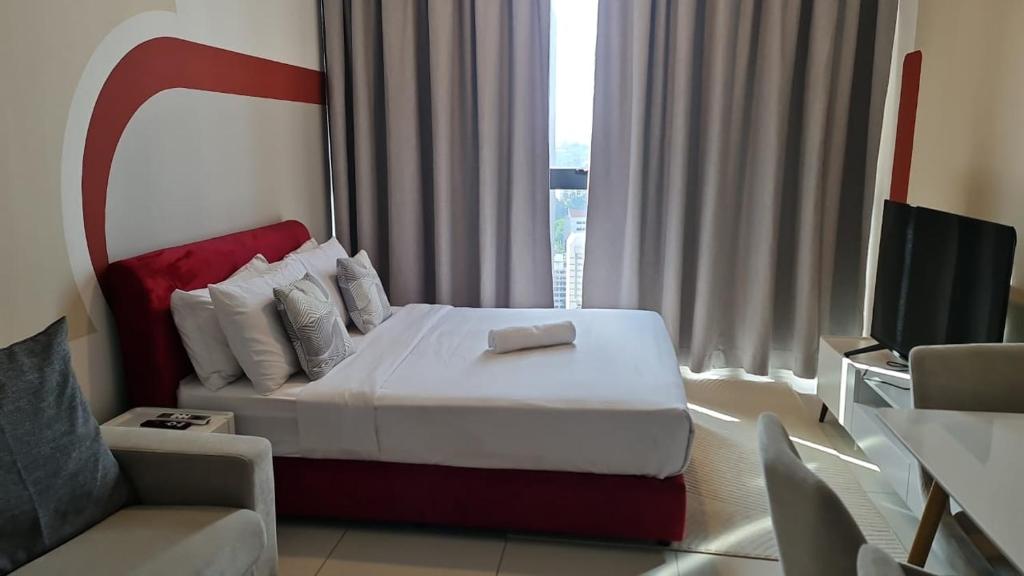 Кровать или кровати в номере Majestic Residence Kuala Lumpur