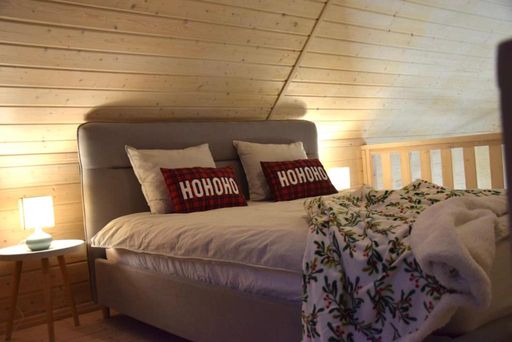 a bedroom with a bed with pillows on it at Polna 31 in Olsztyn