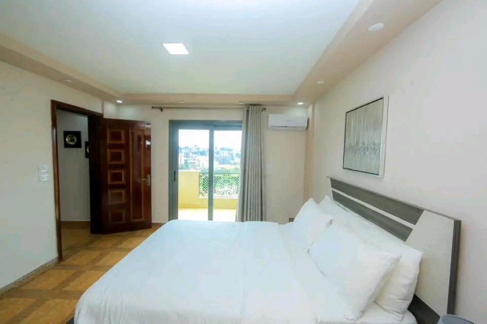 Ένα ή περισσότερα κρεβάτια σε δωμάτιο στο Hall of fame suites