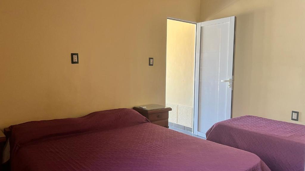 Ένα ή περισσότερα κρεβάτια σε δωμάτιο στο Departamento Las Grutas - Olguita