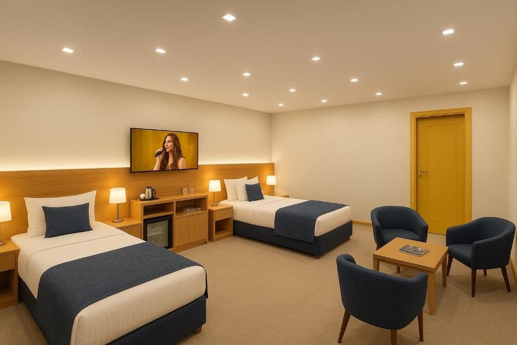 Ένα ή περισσότερα κρεβάτια σε δωμάτιο στο Khatai Deluxe Hotel