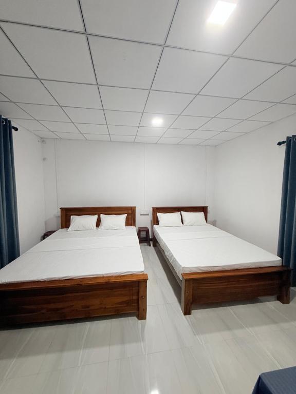 Ένα ή περισσότερα κρεβάτια σε δωμάτιο στο Wildheart Wilpattu Guest