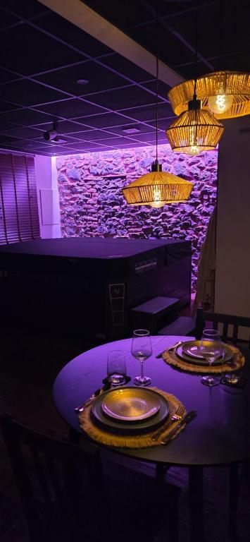 a table in a restaurant with two wine glasses at Instant Evasion in Châtelet