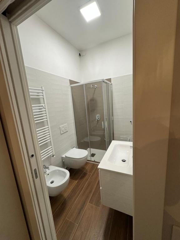 a bathroom with a sink and a toilet and a shower at Ai Cappuccini in Tricarico