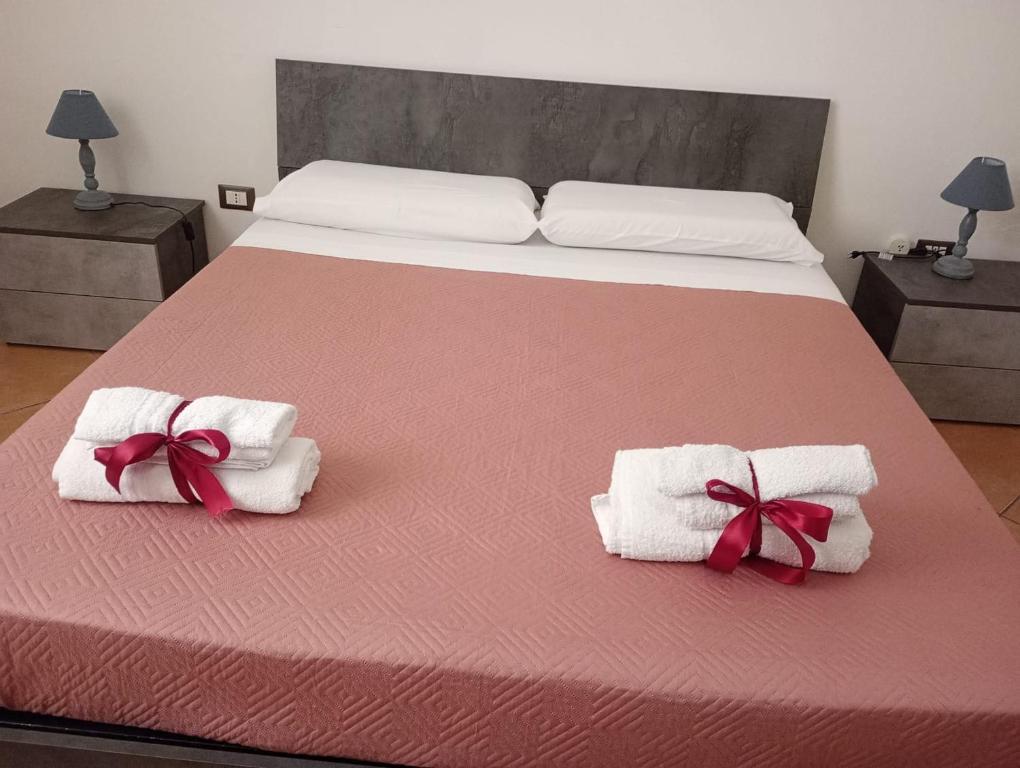 Postel nebo postele na pokoji v ubytování L' Arco Antico