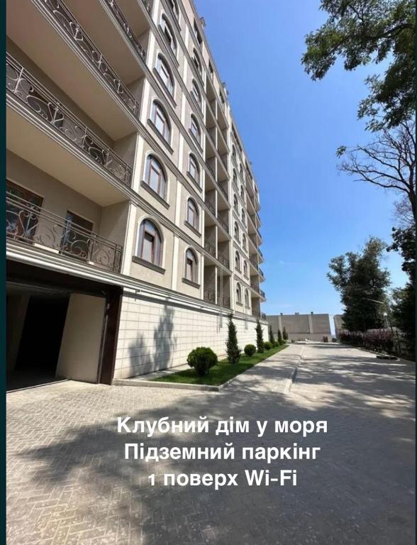 a large building on the side of a street at Avinion 2 Апартаменты у моря in Odesa