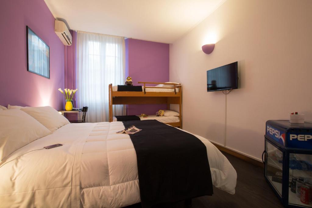Postel nebo postele na pokoji v ubytování Albergo Giardino