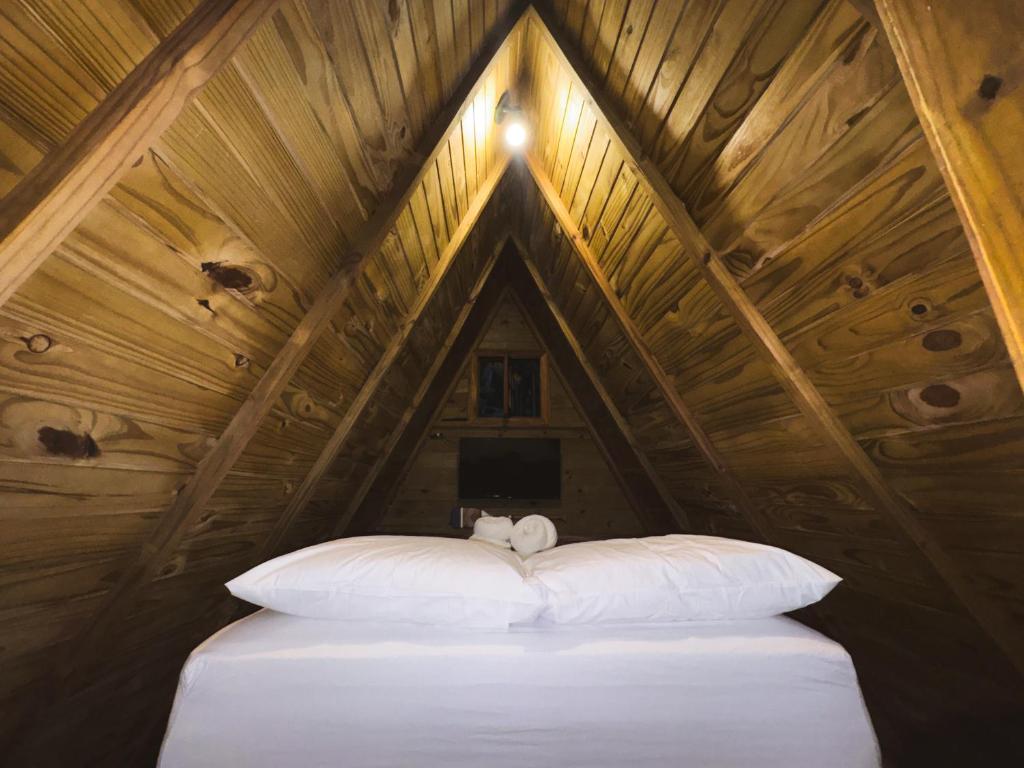 Кровать или кровати в номере cabana suiça