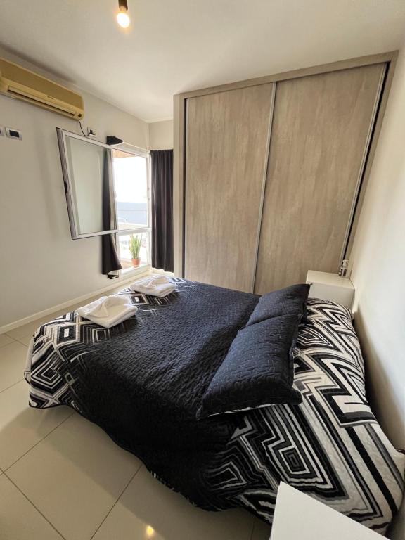 Giường trong phòng chung tại Apartment in San Juan