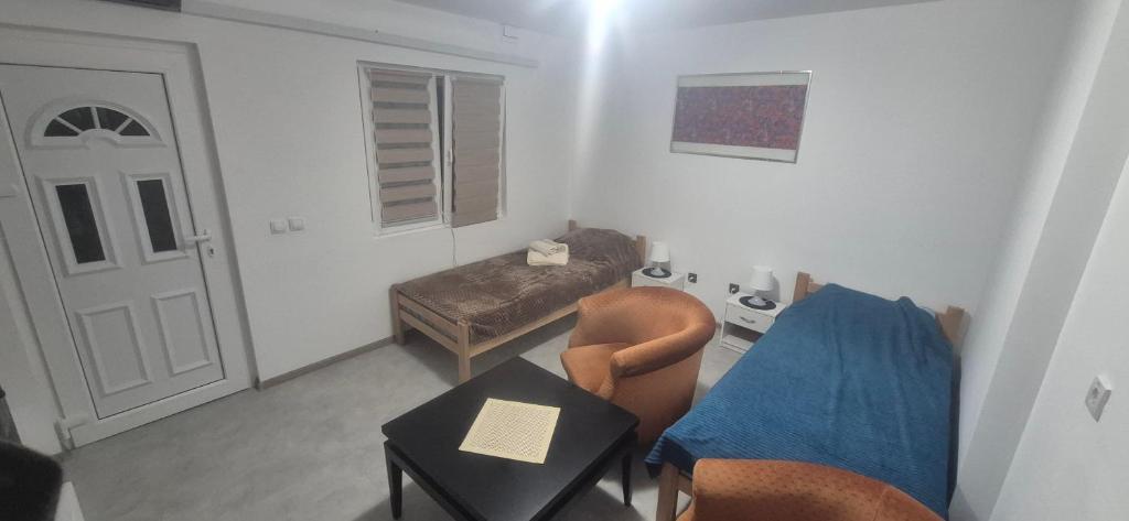 a living room with a couch and a table at Odmorište Noćko in Valjevo