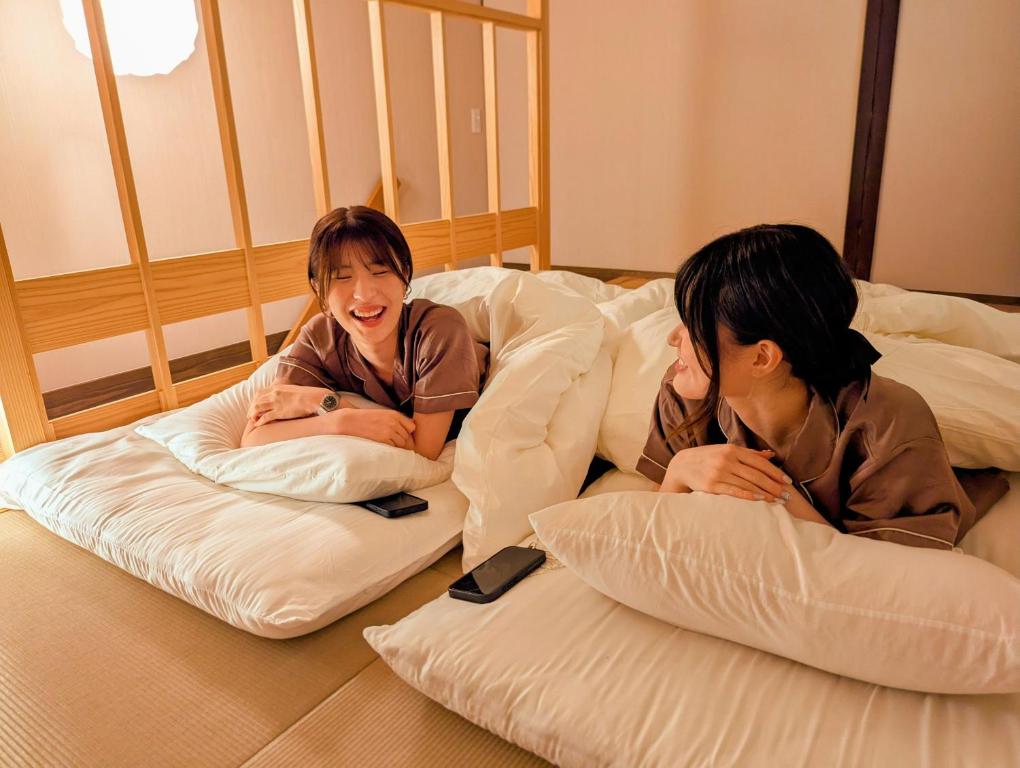 Ένα ή περισσότερα κρεβάτια σε δωμάτιο στο Cafe and Hotel Palette STAYs