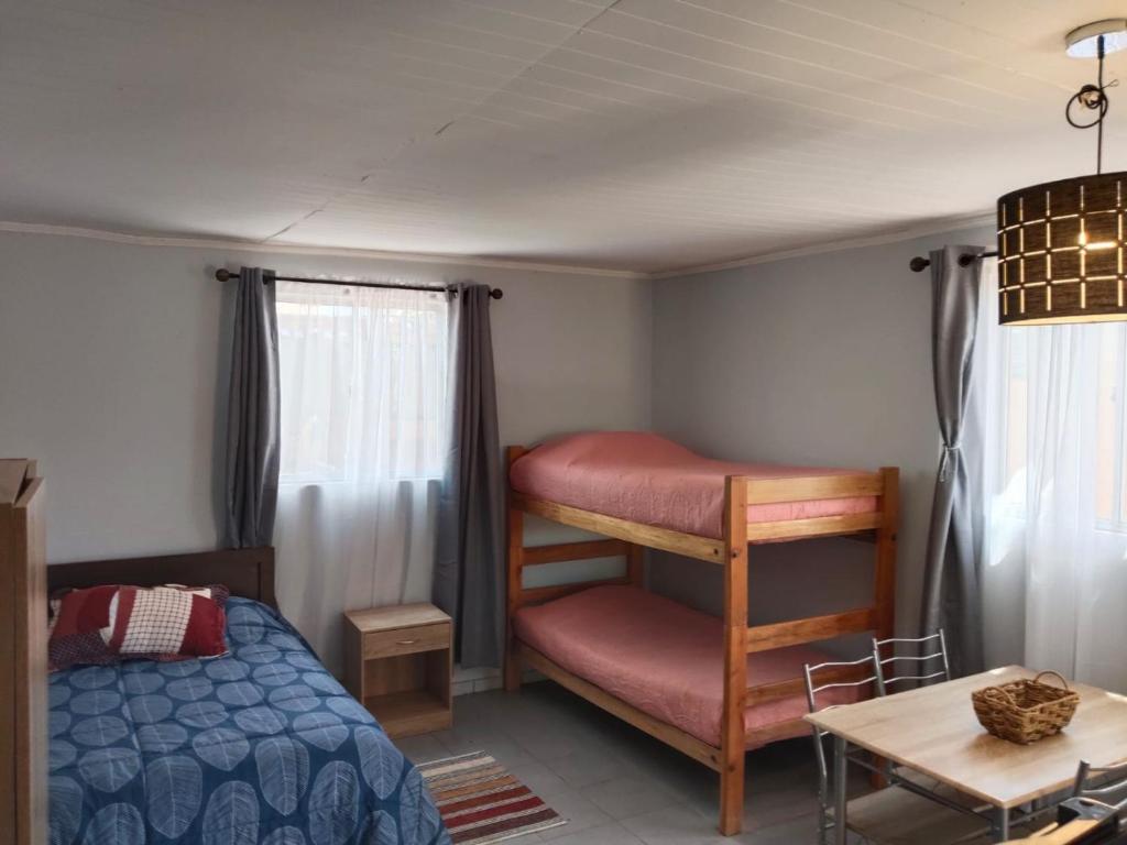 Giường trong phòng chung tại Hostal ribera de Quitor