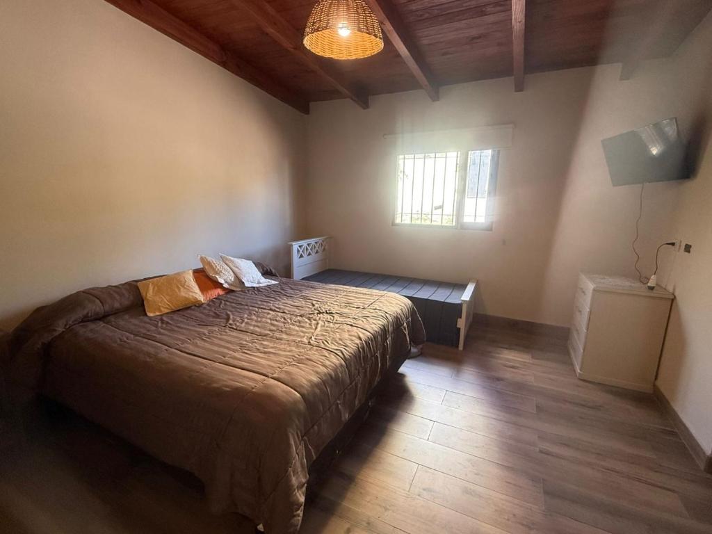 Ένα ή περισσότερα κρεβάτια σε δωμάτιο στο Casa Tafí del Valle