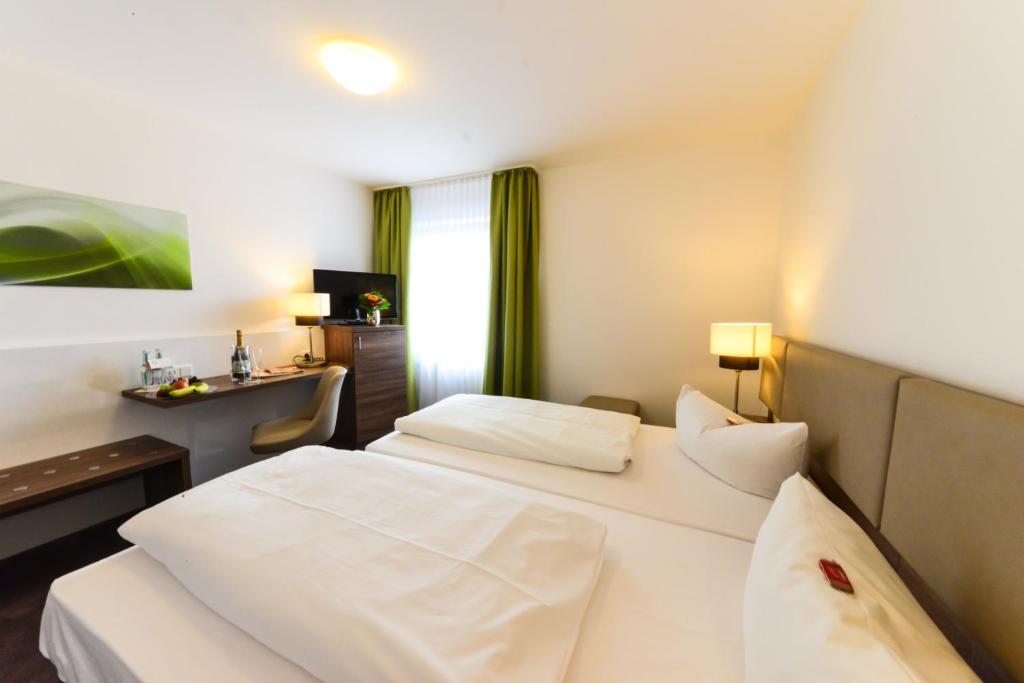 Postel nebo postele na pokoji v ubytování Hotel Günter