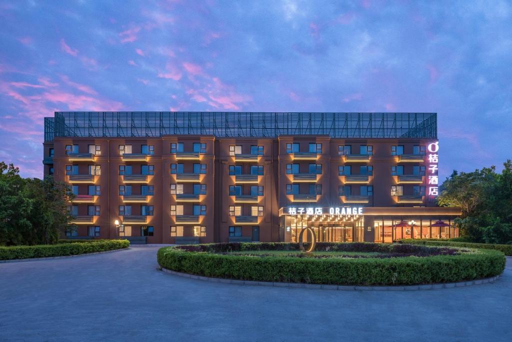 a rendering of a hotel at dusk at Orange Hotel Beijing Xi'erqi in Beijing