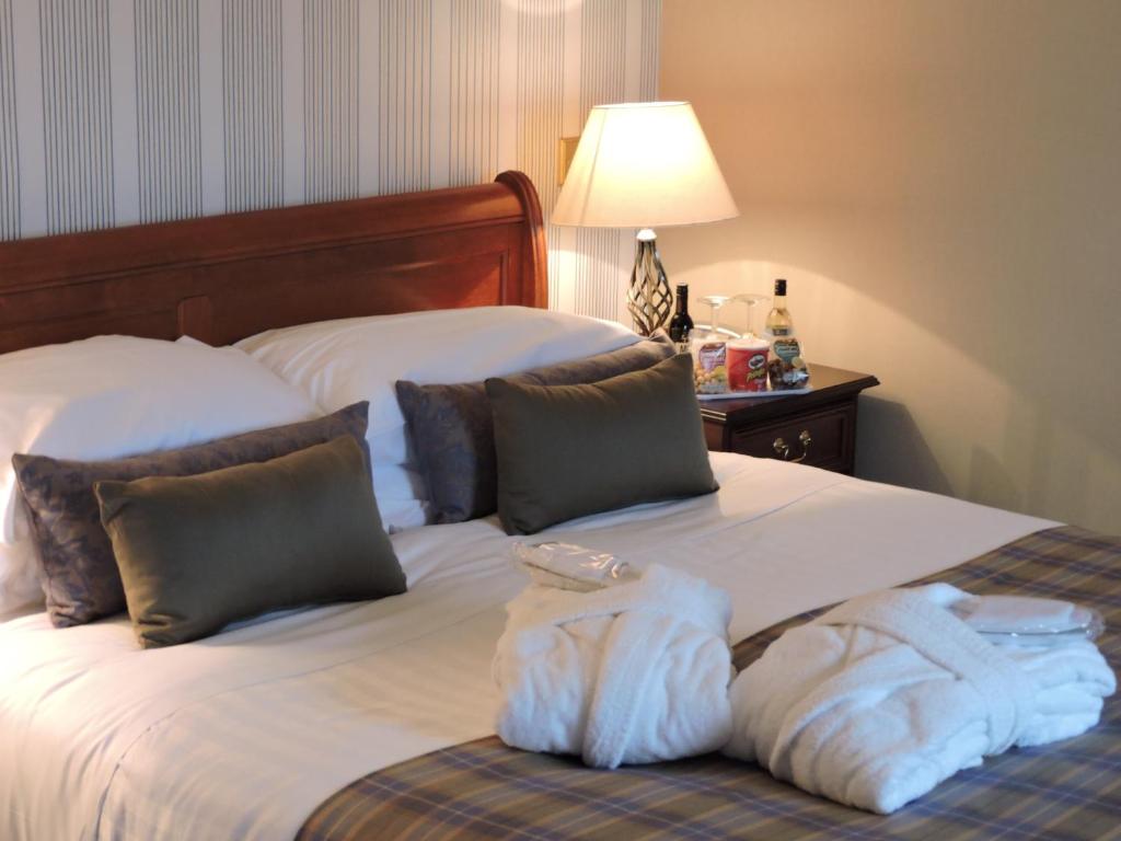 Postel nebo postele na pokoji v ubytování Alexandra Hotel