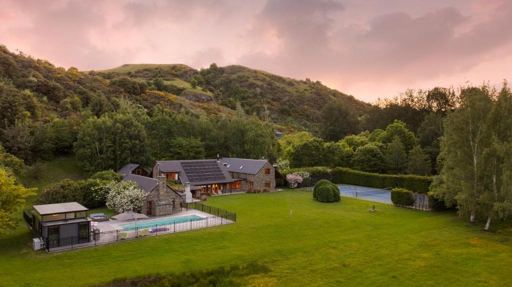 an aerial view of a home in the mountains at Wharenui Holiday Home by MajorDomo in Arrowtown