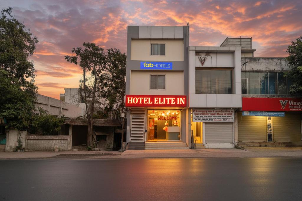 a hotel building with a hotel lender sign on it at FabHotel Elite Inn I in Indore