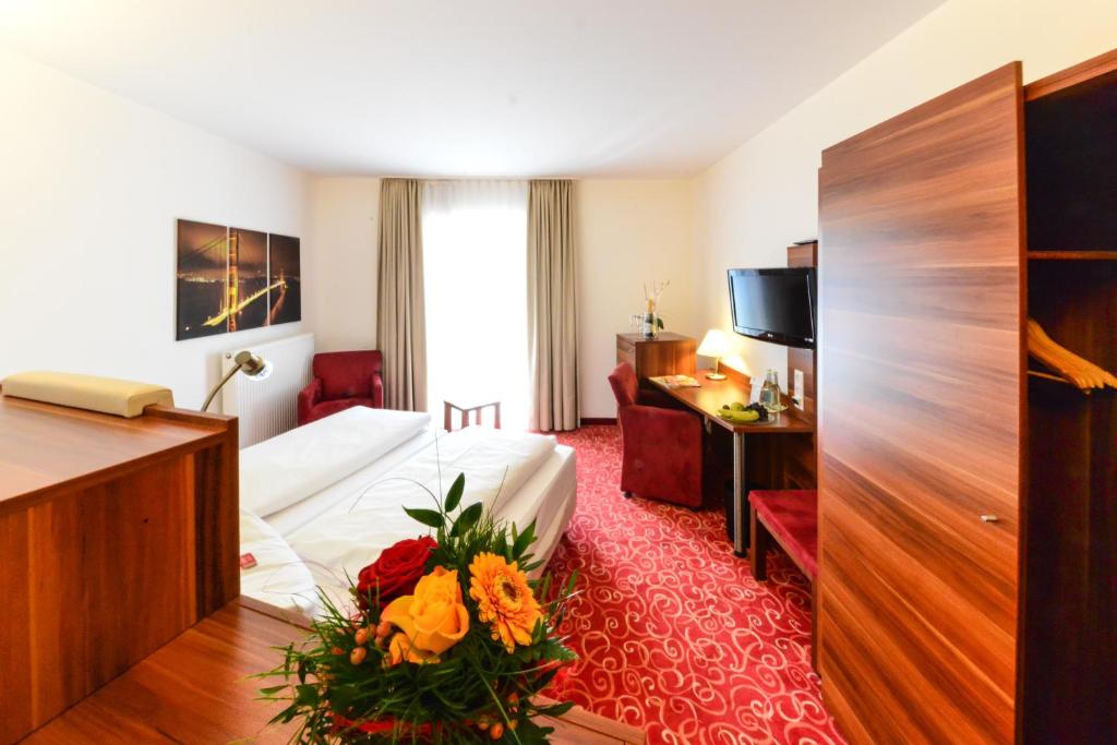 TV a/nebo společenská místnost v ubytování Hotel Günter