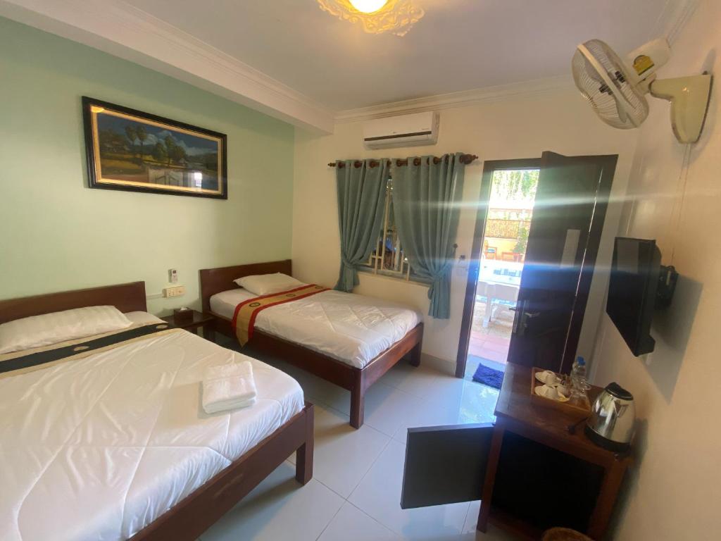 Ένα ή περισσότερα κρεβάτια σε δωμάτιο στο La Villa 23 Signature