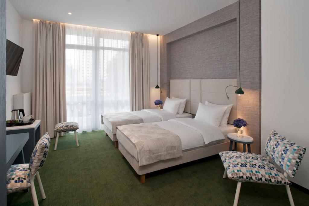 Postel nebo postele na pokoji v ubytování Hotel Metropol