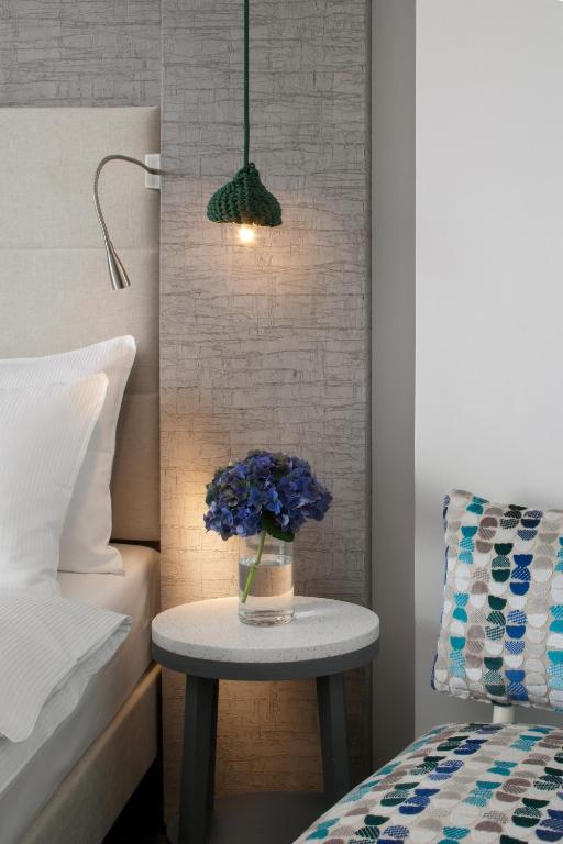 Postel nebo postele na pokoji v ubytování Hotel Metropol