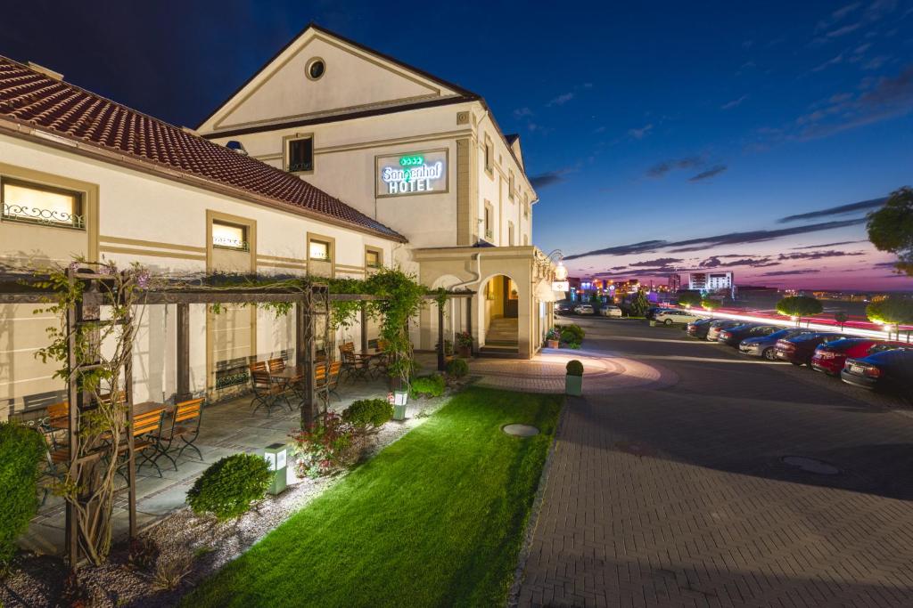 a hotel with a lawn in front of a building at Hotel Sonnenhof in Suceava