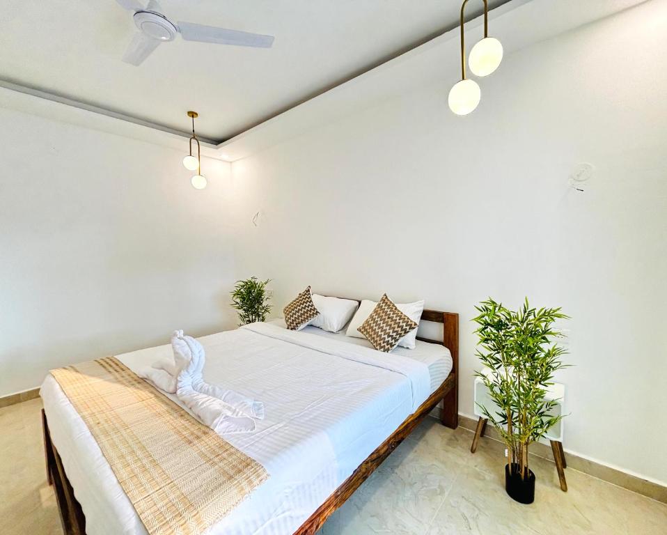 Ένα ή περισσότερα κρεβάτια σε δωμάτιο στο Shades Ivory - Agonda Beach Resort