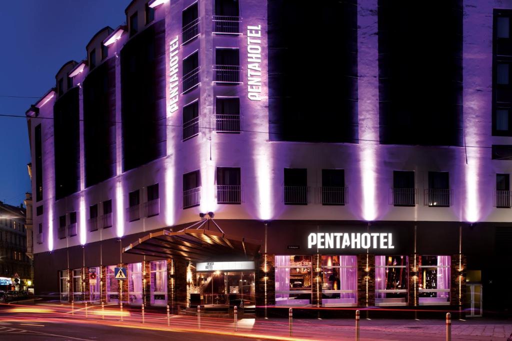 a building with purple lights on the front of it at pentahotel Vienna in Vienna