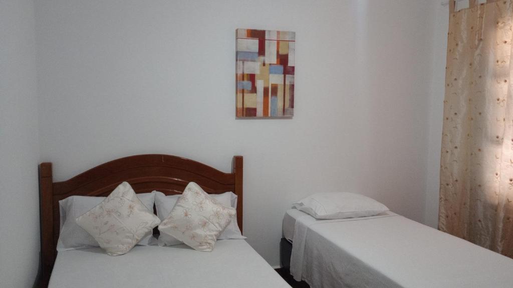 En eller flere senge i et værelse på Hostel Casa Azul