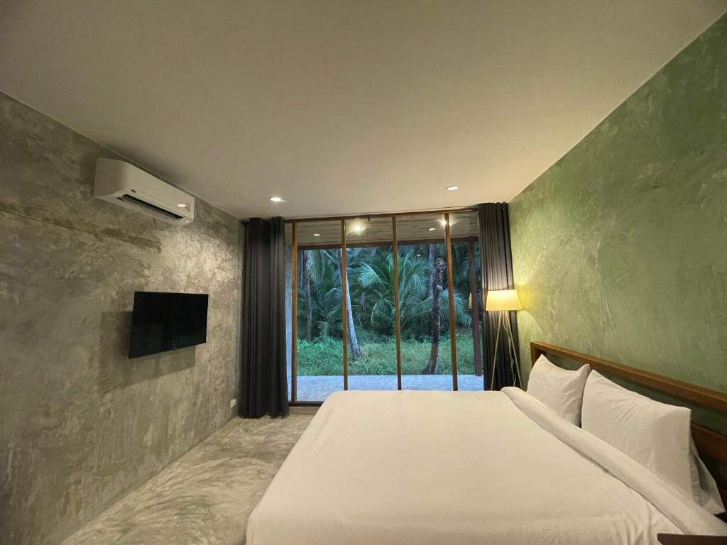 Телевизор и/или развлекательный центр в COCO Home 2 โคโค่โฮม เฟส 2