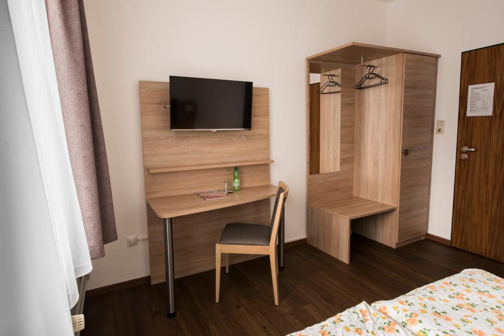 TV a/nebo společenská místnost v ubytování Hotel Baccara