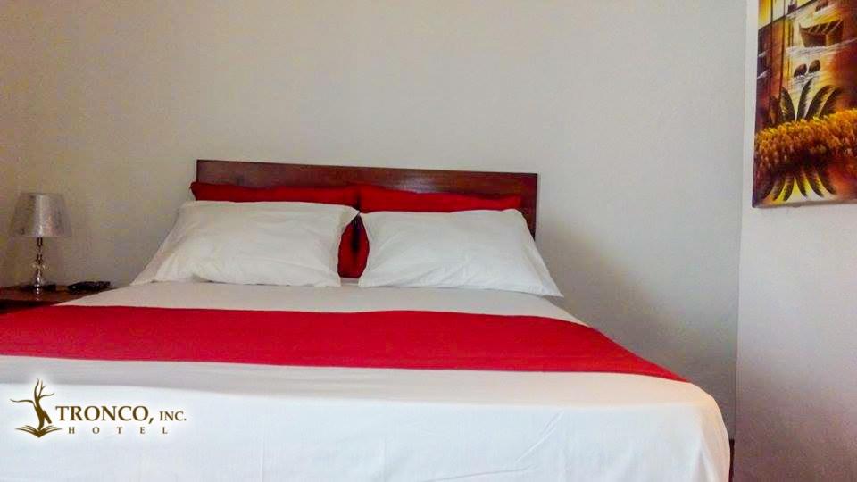 Postel nebo postele na pokoji v ubytování Hotel El Tronco Inc