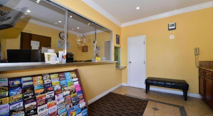 a store with a counter and a bench in a room at Americas Best Value Inn & Suites Los Angeles Downtown SW in Los Angeles