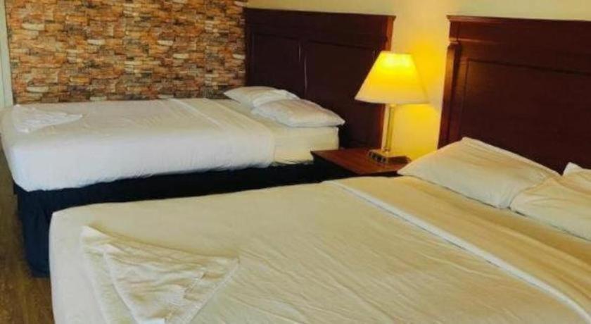 Ένα ή περισσότερα κρεβάτια σε δωμάτιο στο Niagara Best Inn