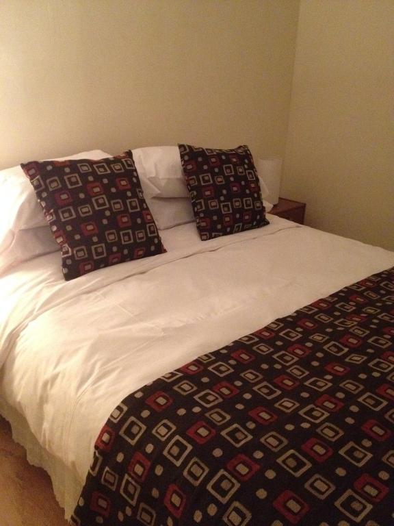 Postel nebo postele na pokoji v ubytování Hostal del Valle