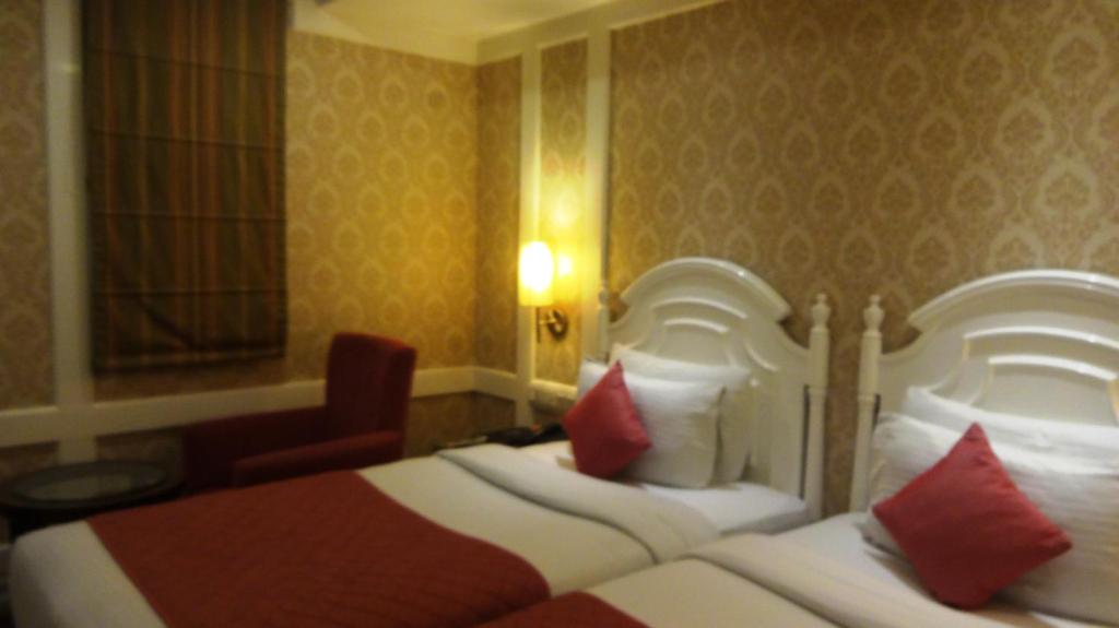 Postel nebo postele na pokoji v ubytování Hotel Bright