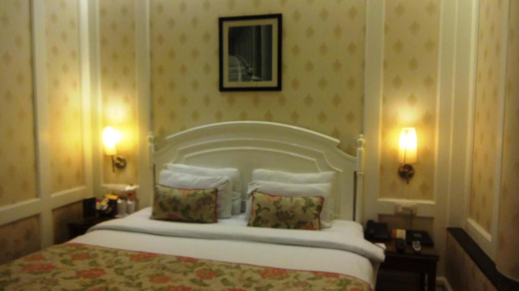 Postel nebo postele na pokoji v ubytování Hotel Bright
