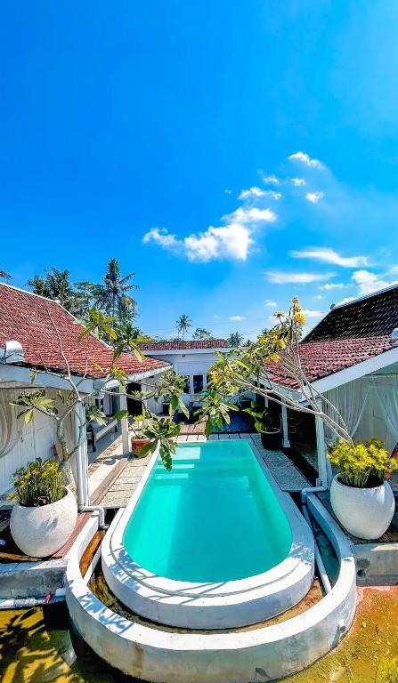 Πισίνα στο ή κοντά στο Sanjaya by Suasana Villa