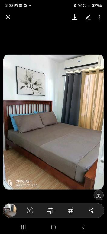 a picture of a bedroom with a large bed at Dream haven condo in Lapasan