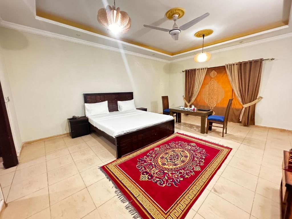 Postel nebo postele na pokoji v ubytování Mashal Guest House Islamabad