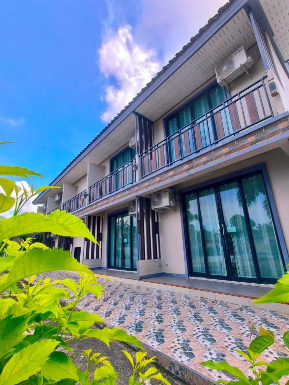 an exterior view of a building with windows at The Coco Grand Chalet in Satun