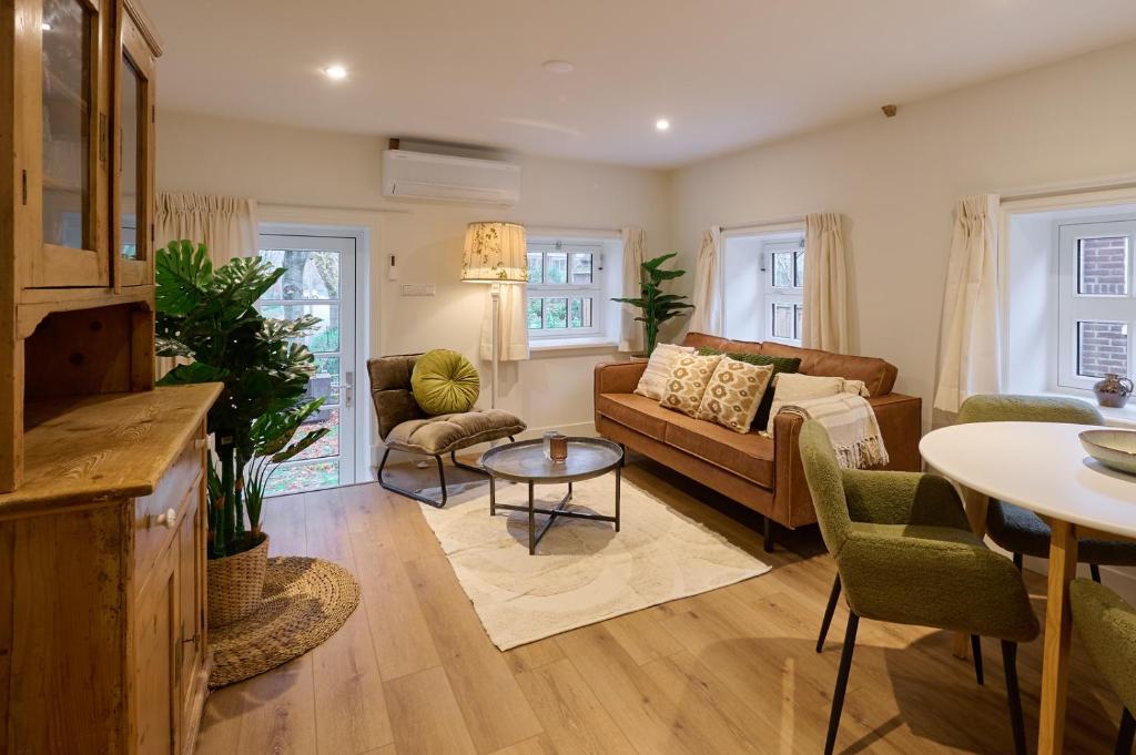 a living room with a couch and a table at Appartement B Rosita in Twisk