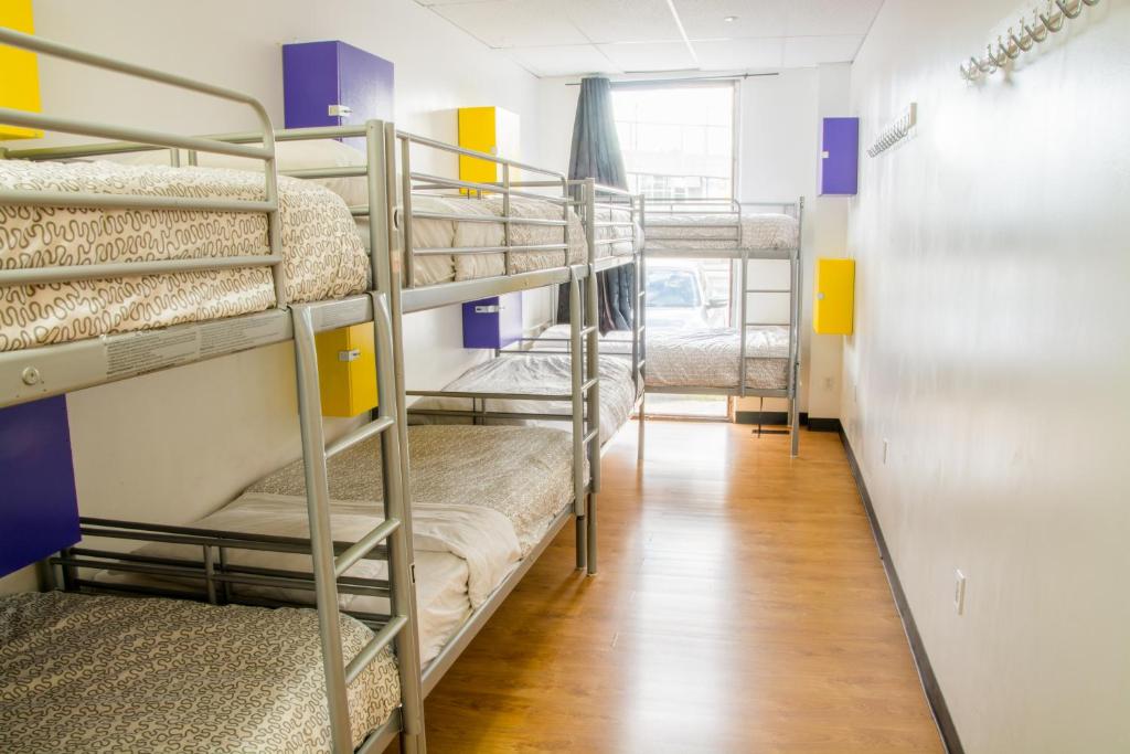 a room with a bunk bed and a window at Wicked Hostels - Calgary in Calgary