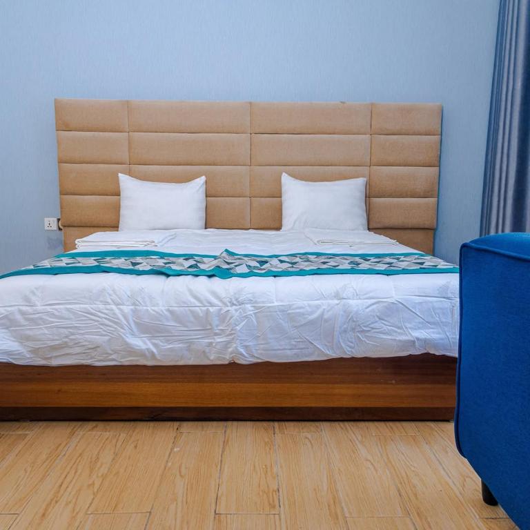 Ένα ή περισσότερα κρεβάτια σε δωμάτιο στο halohome