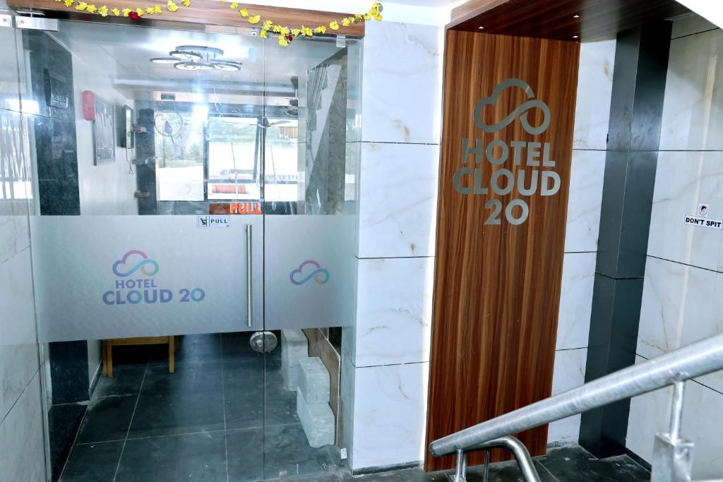 a sign for a hotel cloud in a building at hotel cloud 20 in Jambusar