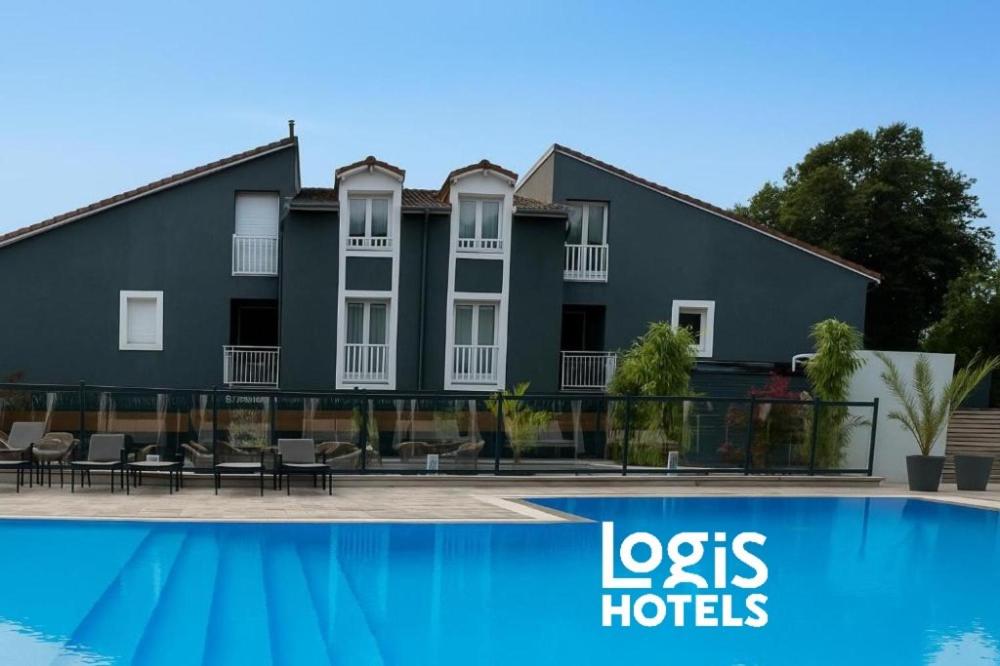 a building with a pool in front of it at Logis Hôtel Blue Garden in Grandvillers