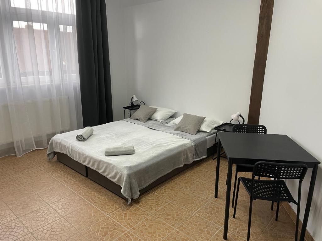 Ένα ή περισσότερα κρεβάτια σε δωμάτιο στο Noclegi w rynku